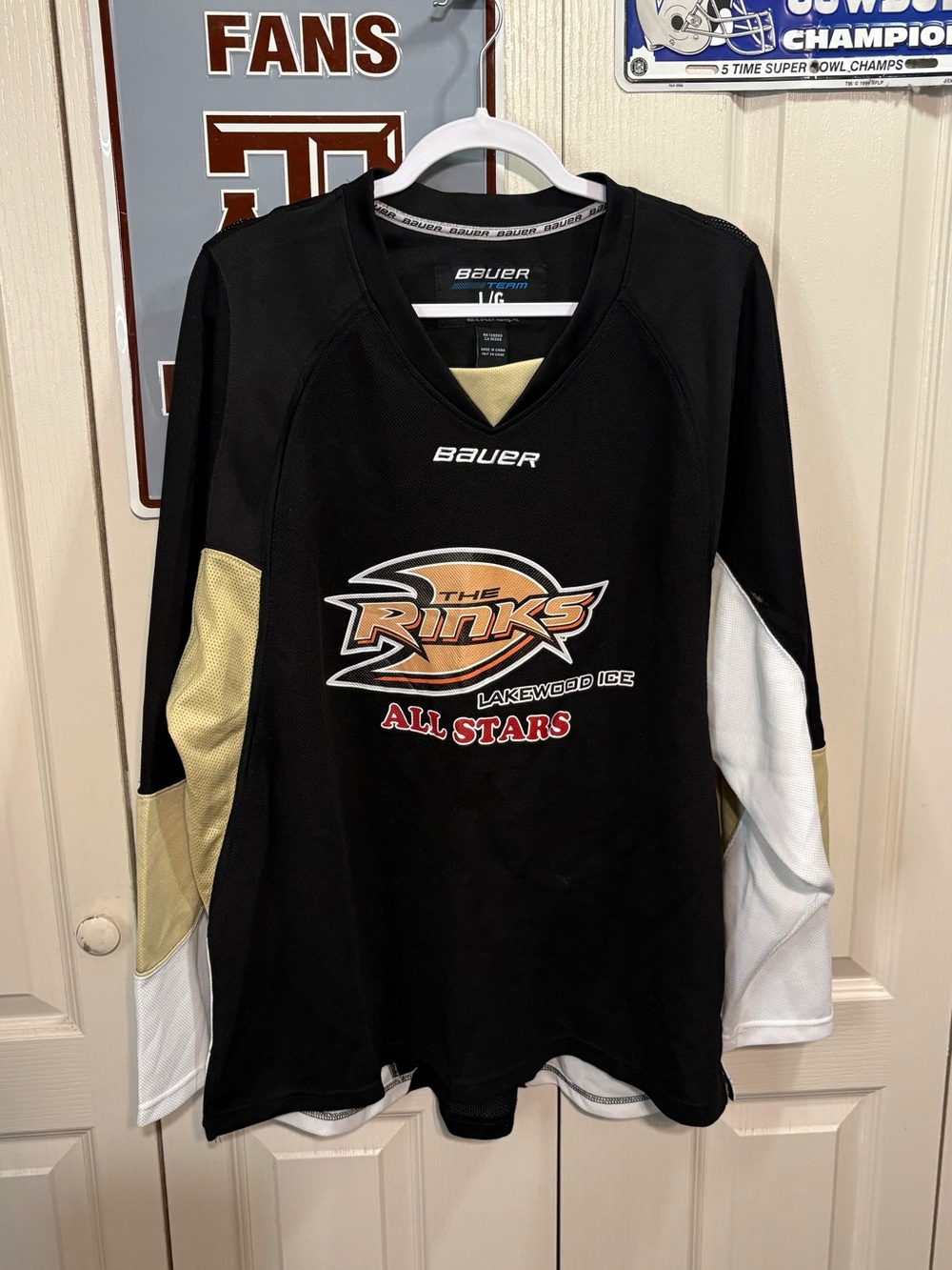 The Rinks Lakewood Ice Black Hockey Jersey with Gold and White Accents